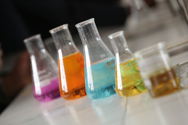 a group of beakers with colored liquids | Dimethicone Supplier