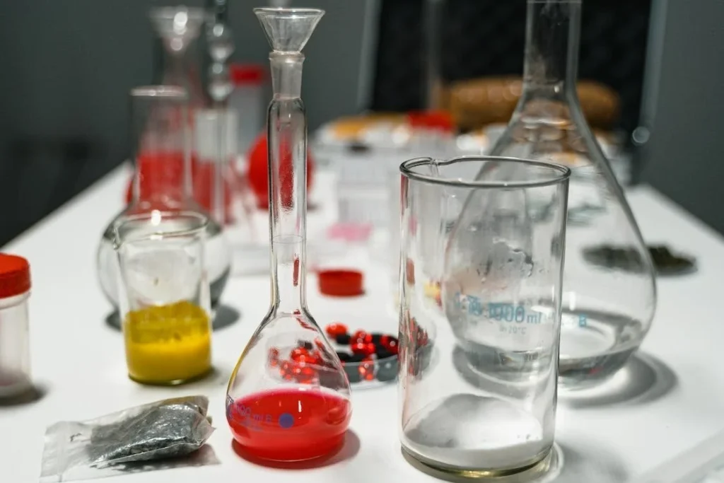 a group of glass beakers with liquid in them